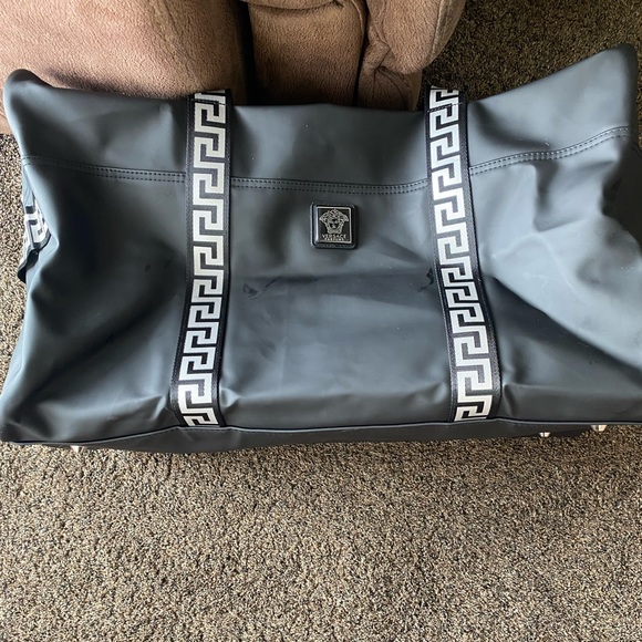 I am selling a Versace duffel bag. It is silver and black. - Picture 2 of 7
